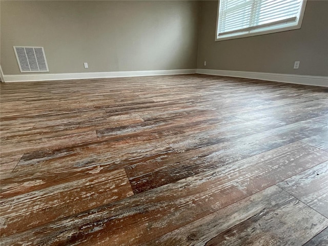 unfurnished room featuring wood-type flooring