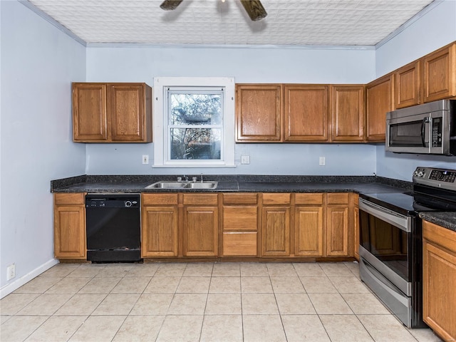 kitchen featuring ceiling fan, sink, stainless steel appliances, dark stone counters, and light tile patterned floors