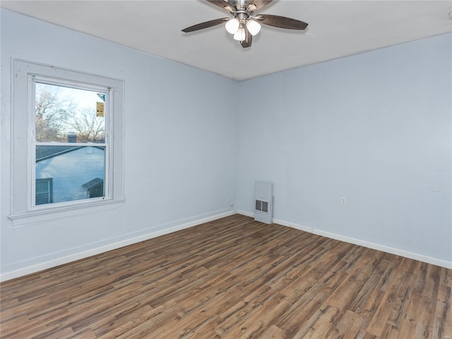 spare room featuring dark hardwood / wood-style floors and ceiling fan