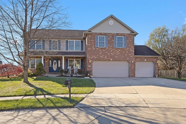 view of front of property with a garage and a front lawn