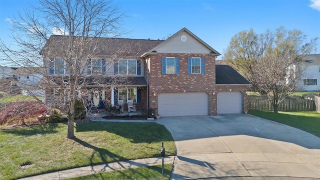 view of front facade featuring a garage, a front yard, and a porch