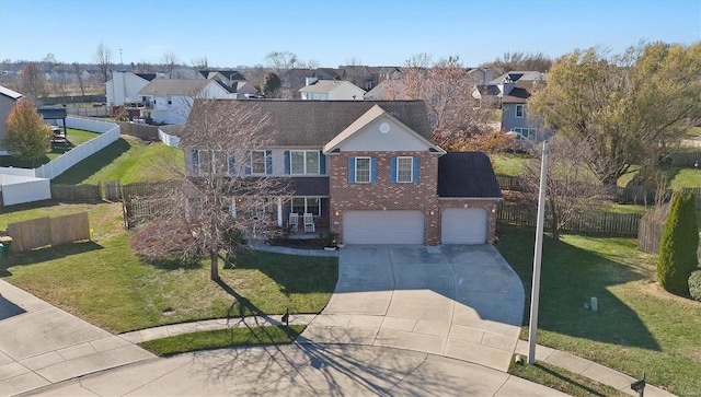 view of front facade featuring a garage and a front yard