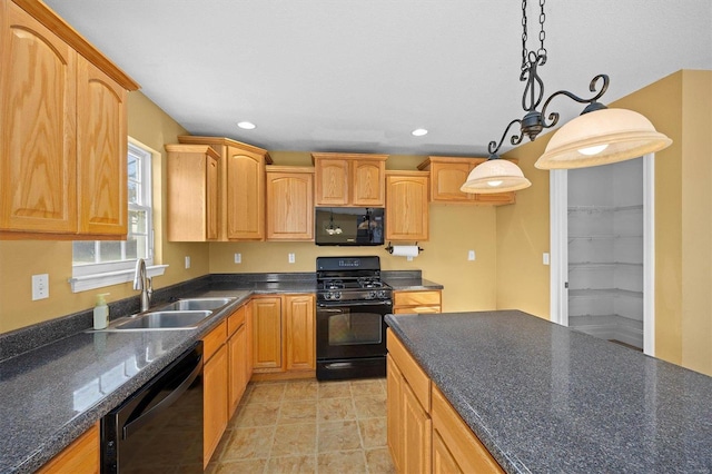 kitchen with light brown cabinetry, decorative light fixtures, sink, light tile patterned floors, and black appliances