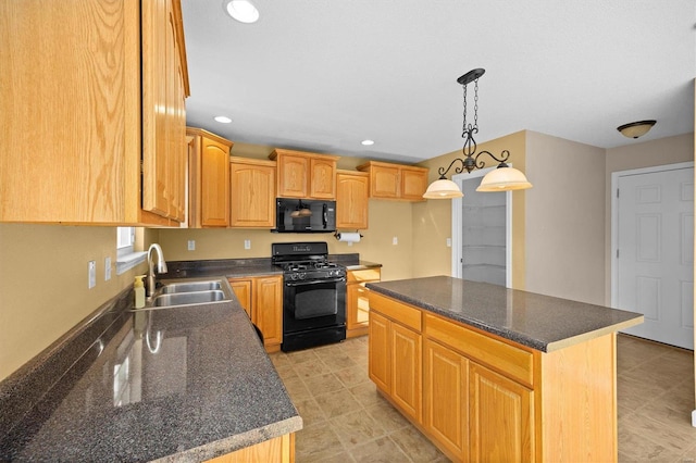 kitchen featuring pendant lighting, sink, a kitchen island, and black appliances