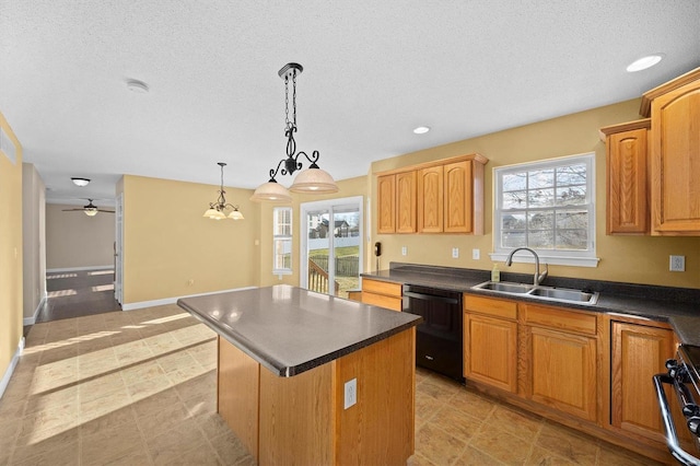 kitchen featuring sink, hanging light fixtures, dishwasher, a kitchen island, and stove