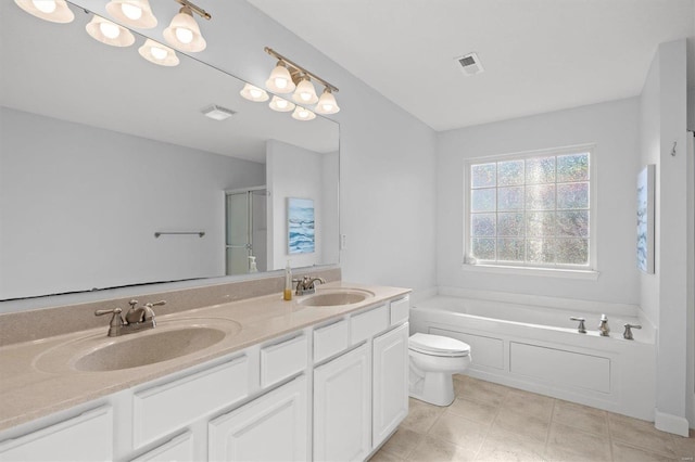 full bathroom with vanity, tile patterned floors, toilet, and separate shower and tub