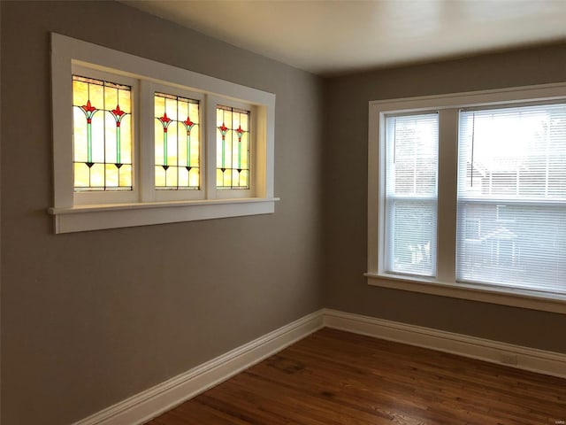 unfurnished room featuring dark hardwood / wood-style floors