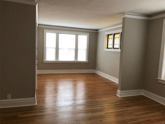 unfurnished room with crown molding and dark hardwood / wood-style floors