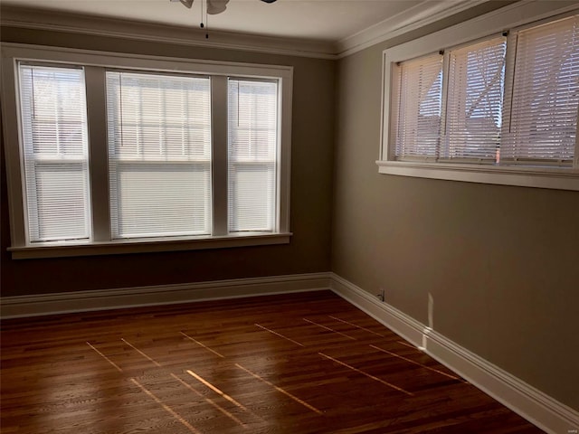 unfurnished room with ceiling fan, dark hardwood / wood-style flooring, ornamental molding, and a wealth of natural light