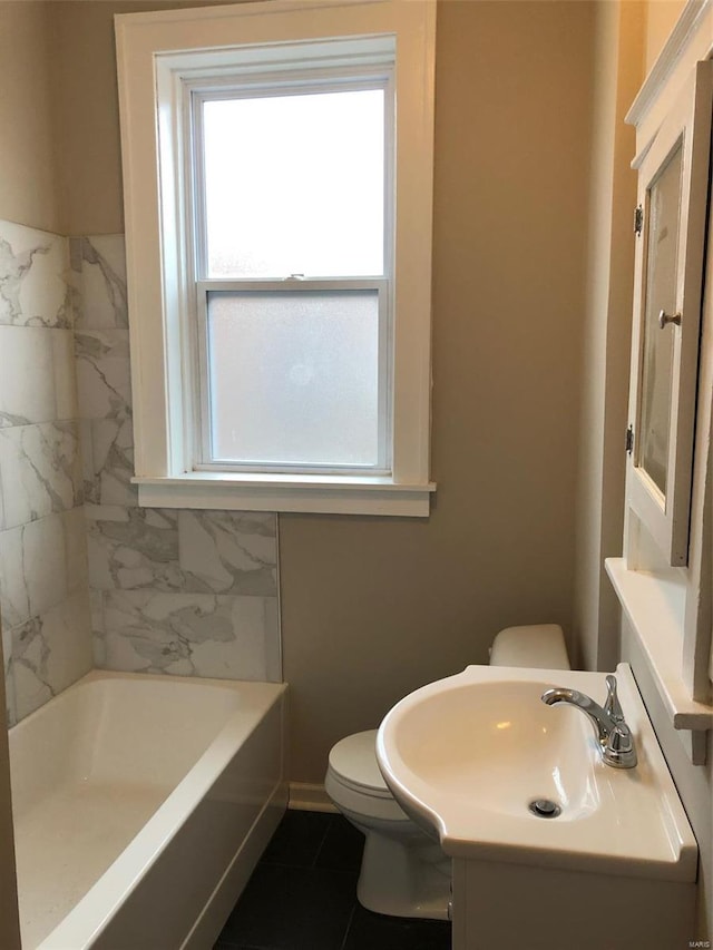 bathroom with tile patterned flooring, vanity, and toilet