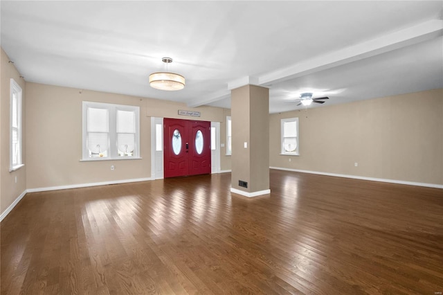 entryway with a wealth of natural light, ceiling fan, and dark wood-type flooring