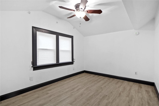 unfurnished room with light hardwood / wood-style floors, ceiling fan, and lofted ceiling