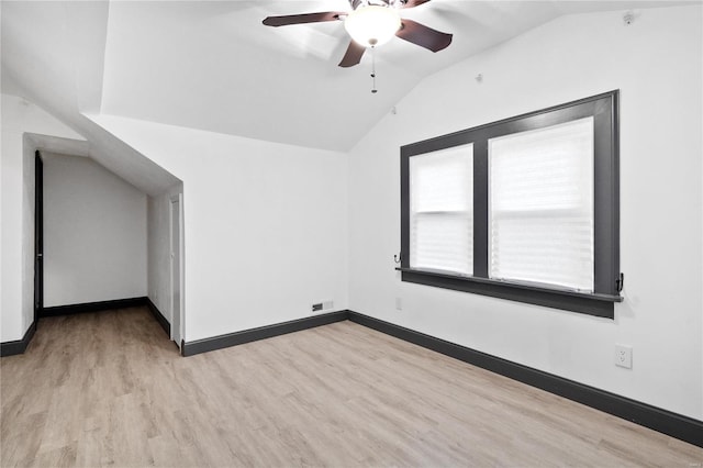 additional living space with ceiling fan, lofted ceiling, and light hardwood / wood-style flooring