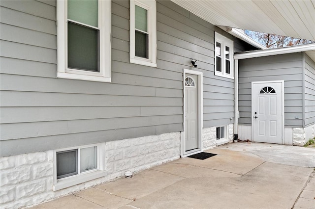 property entrance with a patio area