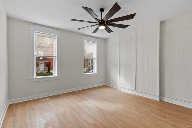 spare room featuring ceiling fan and light hardwood / wood-style flooring