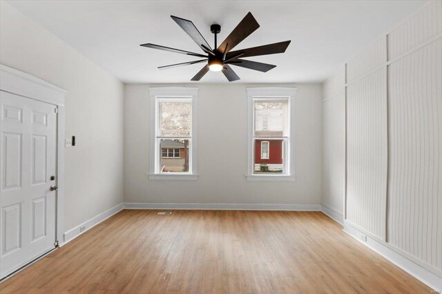 spare room with ceiling fan and light hardwood / wood-style floors