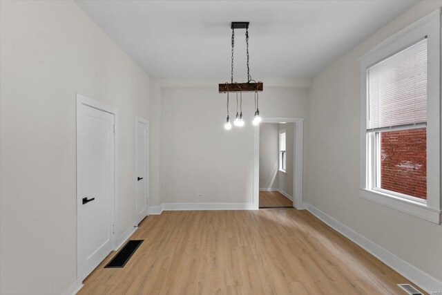 unfurnished room featuring light hardwood / wood-style flooring