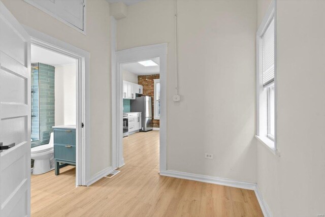 corridor featuring light hardwood / wood-style flooring