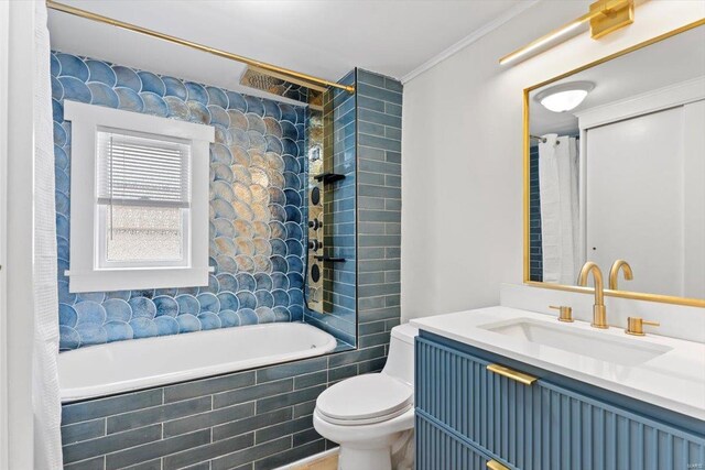 full bathroom featuring vanity, toilet, crown molding, and shower / tub combo with curtain