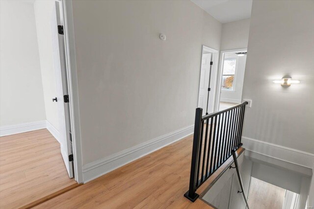 staircase featuring hardwood / wood-style flooring