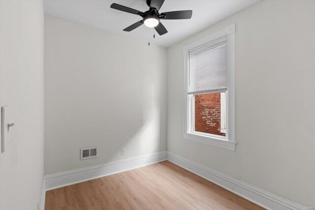 spare room with light hardwood / wood-style flooring and ceiling fan