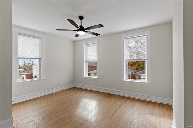 unfurnished room with ceiling fan and light hardwood / wood-style flooring