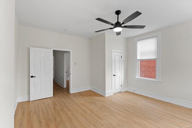 unfurnished room featuring light wood-type flooring and ceiling fan