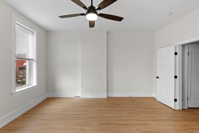 unfurnished room featuring ceiling fan and light wood-type flooring