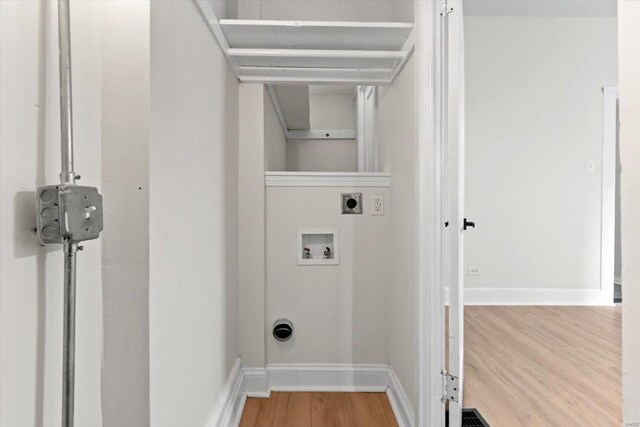 washroom featuring electric dryer hookup, hardwood / wood-style floors, and washer hookup