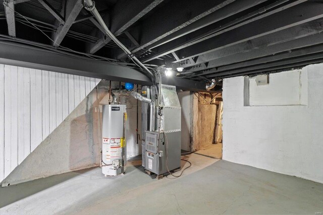 basement featuring heating unit and water heater