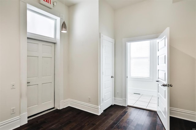 entrance foyer featuring dark hardwood / wood-style floors