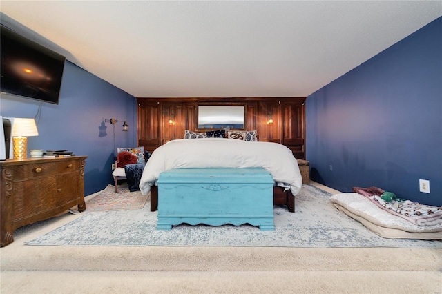 bedroom featuring light carpet