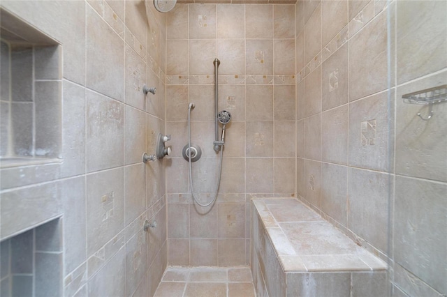 bathroom featuring tiled shower