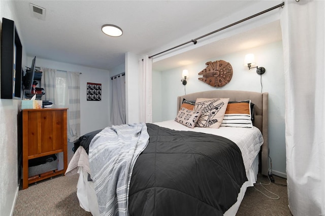 carpeted bedroom with a textured ceiling