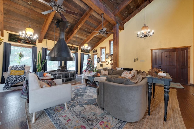 living room with high vaulted ceiling, beamed ceiling, hardwood / wood-style floors, wood ceiling, and ceiling fan with notable chandelier