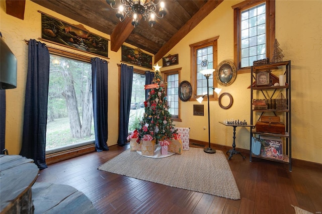 interior space with wood ceiling, dark hardwood / wood-style flooring, lofted ceiling with beams, and a notable chandelier