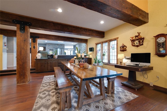 dining space featuring beamed ceiling and dark wood-type flooring