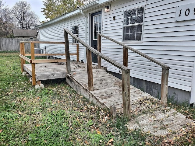 wooden deck featuring cooling unit