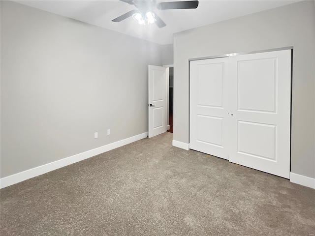 unfurnished bedroom featuring ceiling fan and a closet