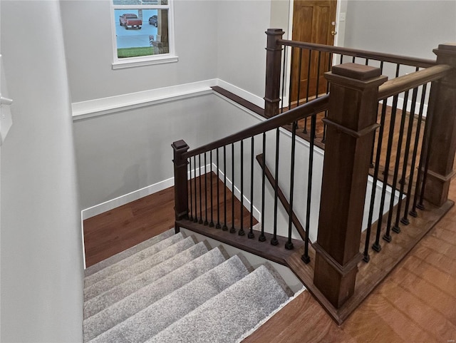 stairs with wood-type flooring