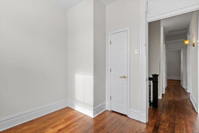 hallway featuring dark hardwood / wood-style floors