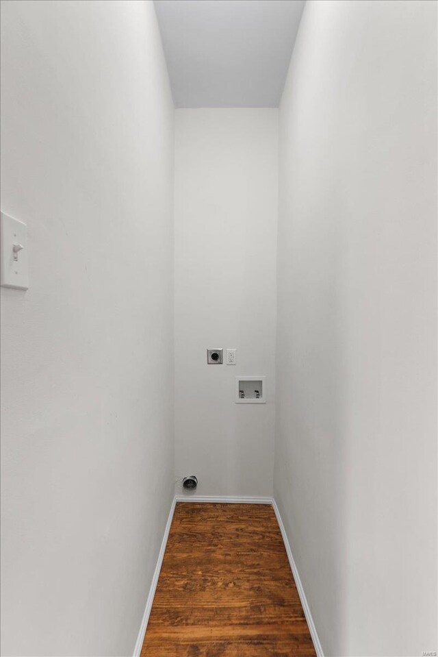 laundry area featuring electric dryer hookup, hookup for a washing machine, and dark wood-type flooring