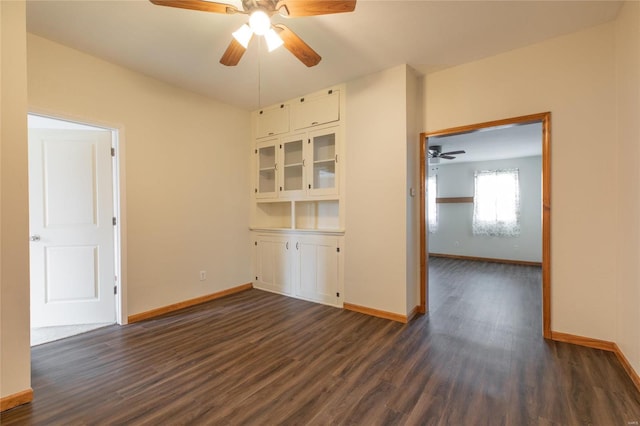 unfurnished room featuring dark hardwood / wood-style flooring