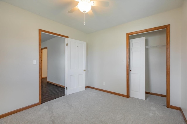 unfurnished bedroom with carpet flooring, ceiling fan, and a closet