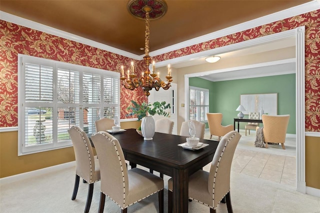 tiled dining space featuring a chandelier, plenty of natural light, and ornamental molding