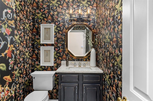 bathroom with vanity and toilet