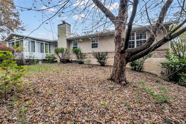 back of property featuring a sunroom