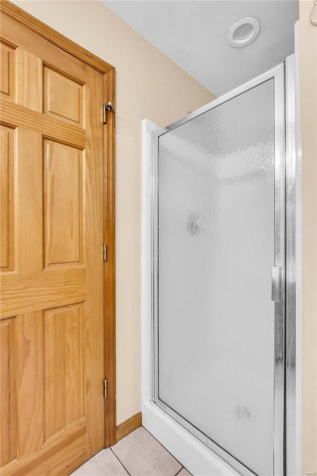 bathroom featuring tile patterned flooring and walk in shower