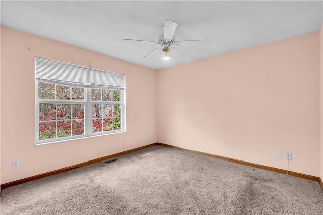 carpeted empty room with ceiling fan