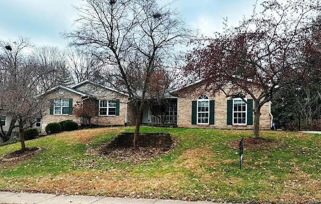 single story home with a front yard